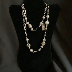 Silver antique-looks necklace.